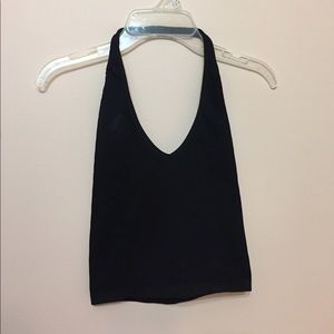 out from under black cropped halter top